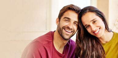 Christian couple smiling into camera