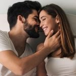 Woman kisses man on the cheek as a symbol of how to kiss well