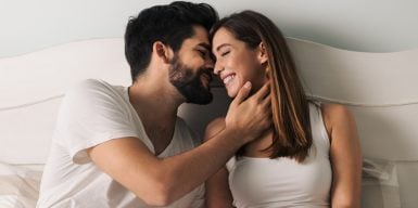 Woman kisses man on the cheek as a symbol of how to kiss well