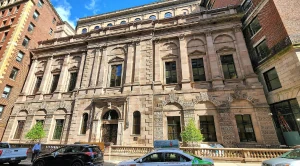 Athenaeum Boston, a historic building with cars in front of (Generated with AI)