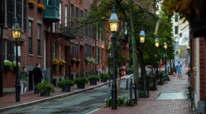 Street with buildings, trees and gaslamps on the sides. (Generated with AI)