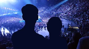 A couple looking at a stage and enjoying live music. (Generated with AI)