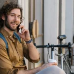 Men smiling and thinking how long should you wait to ask someone out
