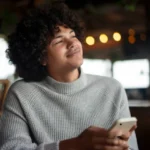 Man looks thoughtful and considers: "should i ask her out"