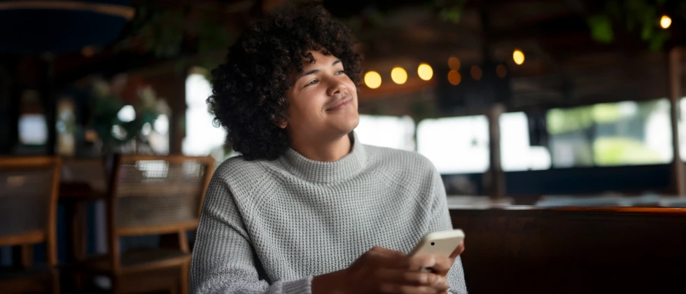 Man looks thoughtful and considers: "should i ask her out"