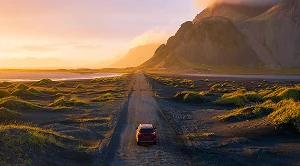 A car driving into the sunset. (Generated with AI)