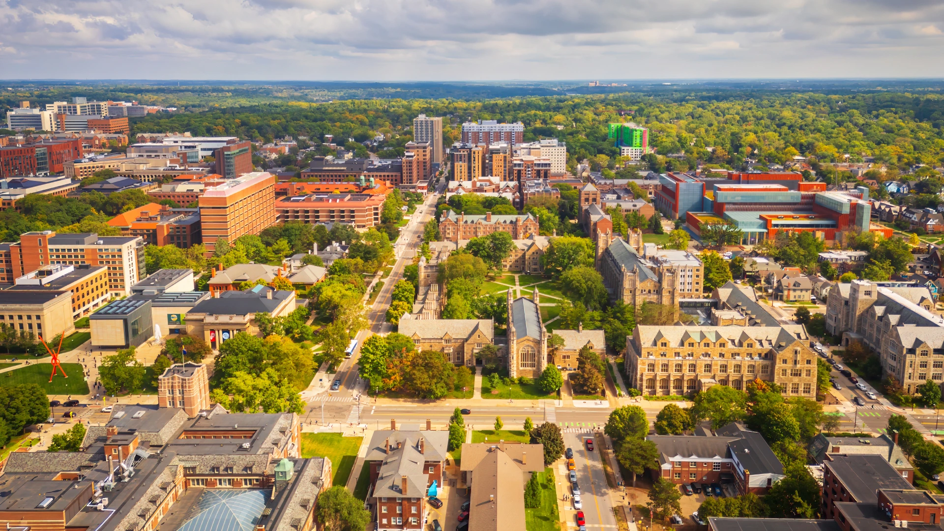 A city view of Ann Arbor, showing houses and green spaces.